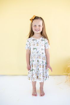 Our Farm Lovin' Dream Ruffle Dress is a cute & quirky dress featuring a fun farm print, ruffled hem, and short sleeves for a playful look. Made with soft and comfortable bamboo material, you'll feel as free as a pig in the mud. Made from the softest and most breathable seasonal bamboo viscose material your babe won't want to take this off! Designed for all the love and extra play! Pig In The Mud, Quirky Dress, Tuxedo Accessories, Girls Dress Outfits, Toddler Flower Girl Dresses, Infant Flower Girl Dress, Bamboo Material, Tea Party Dress