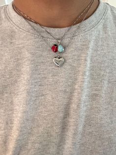 So shiny and cute, this puffed heart necklace is a must-have! Plus, it's waterproof and tarnish resistant. Information: 🤍 Stainless Steel (stamped) | Brass (heart charm) 🤍 Adjustable length: 16" - 18" 🤍 Hypoallergenic 🤍 Tarnish Resistant Our puffed heart necklace is dainty and perfect for everyday wear. Made with quality materials, this necklace is a perfect example of high craftsmanship and attention to detail.  The heart charm is dainty - smaller than a quarter. It's perfect to stack with your other jewelry and create wonderful combinations.  Our necklace is adjustable at 16", 17" and 18" allowing you to find the right fit. This makes a great gift. Dainty Stacked Necklaces, Silver Stainless Steel Necklace With Heart Charm, Everyday Silver Heart Charm Necklace, Valentine's Day Silver Charm Necklace, Dainty Silver Heart Charm Necklace, Valentine's Day Silver Charm Necklace With Delicate Chain, Steel Stamp, Stacked Necklaces, Puffed Heart