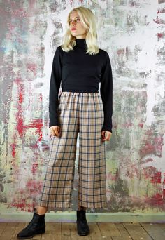 Cropped Trousers in Beige Check   Tartan crop pants, deets include:beige check fabric(with white and black)with a slightly cropped length and an exposed black elastic waist. Designed and made in our UK studio (customise the length for free) also available as a co-ord, in other colours and the fabric is available in other styles (including cargo pants and shorts) Last pic shows the blue and pink fabrics available. Relaxed Fit Plaid Pants With Elastic Waistband, Plaid Relaxed Fit Straight Pants, Plaid Straight Pants With Relaxed Fit, Plaid Trousers For Spring, Relaxed Fit Plaid Straight Pants, Plaid Wide-leg Pants For Spring, Plaid Ankle-length Pants For Spring, Spring Plaid Wide-leg Pants, Spring Plaid Ankle-length Pants