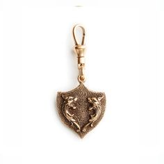 Royal Crest Charm by Fallen Aristocrat - The Paris Market Heirloom Bronze Brass Jewelry, Antique Gold Engraved Brass Jewelry, Collectible Gold-tone Brass Jewelry, Collectible Engraved Brass Jewelry, Luxury Collectible Bronze Jewelry, Engraved Brass Collectible Jewelry, Classic Gold Jewelry With Brass Hardware, Victorian Style Oxidized Gold Jewelry, Medieval Style Metal Jewelry With Antique Finish