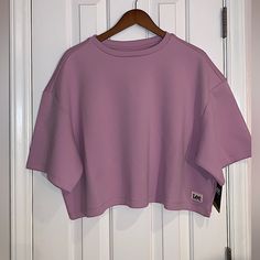 Nice Cropped Short Sleeve Sweatshirt In Sugar Lilic Size Xl, Pit To Pit Measurement 29 Inches Purple Relaxed Fit Casual Top, Purple Relaxed Fit Top For Fall, Spring Purple Athleisure Tops, Oversized Lavender Top For Fall, Oversized Purple Top For Loungewear, Lavender Relaxed Fit Tops For Loungewear, Fall Pink Drop Shoulder Top, Pink Short Sleeve Casual Sweatshirt, Purple Relaxed Fit Sporty Tops