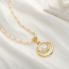 Adorn your neck with the remarkable elegance of our Oval Pearl Necklace. Crafted with 18k gold, this luxurious accessory will complete any ensemble with its timeless sophistication. With its alluring classic design, its sure to make a statement of timeless style. DETAILS Plating: 18K Gold Materials: 18K Gold on Brass, Freshwater Pearl Measurements: Length: 16.54"(42.0cm) + Extender: 2.36"(6.0cm) Weight:  36.59 g Elegant Gold Pearl Chain Necklace, Gold Necklace With Pearl Chain And Oval Pendant, Oval Gold Necklace With Pearl Chain, Elegant Gold Pearl Necklace With Charm, Elegant Gold Pearl Drop Necklace, Gold Oval Pearl Necklace With Pearl Charm, Oval Gold Pearl Necklace With Pearl Charm, Gold Refined Pearl Necklace, Refined Gold Pearl Necklace Gift