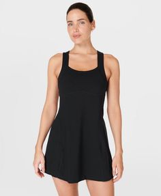 Our sporty new workout dress for styling out the sweatiest of sessions. Sweat-wicking Power Pro fabric is breathable and stretchy with a matte finish. Slim, body-skimming fit with contrasting panels and a flattering racerback. Supportive inner shorts with slip pocket. In-built bra with removable pads. Length: 77.5cm / 31". Model wears size S and is 178cm/5'10" tall. Style Code: SB9287BColour: Black Workout Dress, Racerback Dress, Sport Dress, Sweaty Betty, Powerful Women, Like A Pro, Moisture Wicking Fabric, Stay Cool, The Streets