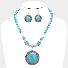 "Beautiful Burnished Silver Turquoise Beaded Round Pendant Necklace and Earring Set. Silver Metal Alloy. Lead & Nickel Compliant. Necklace Size: 20\" + 3\" L; Decor Size: 2.25\" L and Earring Size:1.75\" L. The Perfect Accessory to Add Just A Touch of Western Flair to Your Wardrobe." Turquoise Dangling Beads Costume Jewelry, Turquoise Costume Jewelry With Dangling Beads, Turquoise Beaded Dangle Necklaces, Turquoise Beaded Dangle Jewelry, Bohemian Beaded Round Turquoise Necklace, Bohemian Beaded Turquoise Necklace, Turquoise Beaded Costume Jewelry Necklace, Costume Jewelry Turquoise Beaded Necklace, Adjustable Turquoise Jewelry With Large Beads