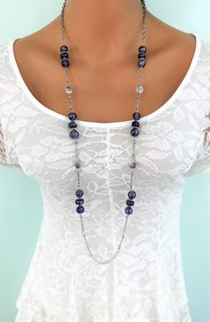 Long Purple Beaded Necklace handmade by Ralston Originals. This purple necklace is made with large purple glass beads,round, and flat. It has silver metal beads with a leaf design, and small antique silver metal beads between the purple beads. The necklace includes long silver metal links with antique details, and silver metal link chains. This necklace is 40 inches long, and a lobster clasp. This beaded necklace is ready to send to you today, includes free shipping. I carefully package it, and Elegant Purple Necklace With Large Beads, Silver Beaded Amethyst Crystal Necklace, Silver Beaded Necklaces With Faceted Amethyst, Silver Beaded Necklace With Faceted Amethyst Beads, Silver Amethyst Beaded Crystal Necklace, Silver Amethyst Beaded Necklace With Faceted Beads, Purple Jewelry With Large Round Beads, Silver Crystal Necklaces With Large Beads For Jewelry Making, Silver Crystal Necklaces With Large Beads For Gifts