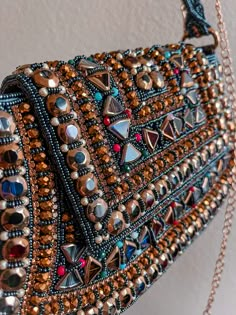 You don't have to be famous to live out your own red-carpet moment! our unique gorgeous handmade bags will help you in this. Emirates, Moroccan and Turk style in a single version. It's not just a bag this piece of art! Almost all bags presented in a single copy. The sparkling gold rhinestones glimmer, and beautiful tiny strap adds even more sparkle to this bag. With its lined interior, fits just the essentials. Embellished Shoulder Bag For Party, Luxury Embellished Shoulder Bag For Party, Handmade Rectangular Shoulder Bag For Party, Handmade Shoulder Bag For Party, Glamorous Pouch Shoulder Bag As Gift, Glamorous Pouch Shoulder Bag For Gift, Glamorous Gift Pouch Shoulder Bag, Crystal Embellished Shoulder Bag For Party, Glamorous Embellished Handheld Shoulder Bag