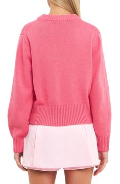 A relaxed, slightly oversized fit adds to the cozy vibes of this playfully pink cotton-blend sweater knit with ribbed trim. Crewneck Long sleeves Ribbed cuffs and hem 50% cotton, 30% acrylic, 20% wool Hand wash, dry flat Imported Pink Sweatshirt With Ribbed Collar For Spring, Relaxed Fit Spring Sweater With Ribbed Collar, Fall Pink Sweater With Ribbed Cuffs, Pink Fall Sweater With Ribbed Cuffs, Spring Relaxed Fit Cropped Sweater, Spring Pink Cardigan With Ribbed Cuffs, Casual Pink Sweater With Ribbed Cuffs, Pink Knit Sweatshirt, Pink Crew Neck Cropped Sweater For Fall