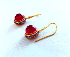 Golden plated Earrings Red Carnelian Gem. Coloured Cloisonne enameled. High quality.    Handmade ethnic antique design egyptian style ring Metal Type - 18k Gold plated Gem Colour - Red The earrings are delivered with a jewelry box.  Combined shipping! Red Temple Jewelry For Pierced Ears, Temple Jewelry In Enamel As A Gift, Jeweled Enamel Earrings For Gift, Enamel Jeweled Earrings For Gift, Handmade Red Temple Jewelry Earrings, Traditional Red Jewelry For Collectible, Traditional Red Jewelry For Collectors, Traditional Red Earrings For Ceremonial Occasions, Red Round Temple Jewelry Earrings