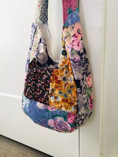 a multicolored purse hanging on the wall