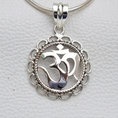 Metal-925 Sterling Silver This One of a kind Om Pendant Add this beautiful one little thing of galactic shine to make you feel unique and to transform your lives.Perfect for any kind of outfit and every occasion. About: 'OM' charms have their own significance. These jewelry pieces can be used for beautification and will also ensure financial as well as emotional satisfaction Wearing an 'OM' charm is said to bring harmony, peace and eternal bliss to the ones who wear them We accept custom and per Spiritual White Gold Pendant Jewelry, Nickel Free Sterling Silver Pendant Charm Necklace, Spiritual White Gold Jewelry With Large Pendant, Spiritual Sterling Silver Necklace Gift, Spiritual Sterling Silver Necklace, Spiritual Sterling Silver Necklace Ideal For Gifting, Spiritual White Gold Jewelry, Handmade Sterling Silver Pendant Charm Necklace, Handmade Unique Sterling Silver Charm Necklaces