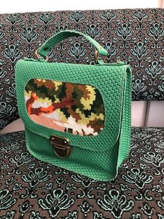 Green leather handbag with needlepoint, small green leather handbag, green purse for women, leather bag for women, colorful urseThis adorable small handbag is made from genuine Italian green leather, combined with a vintage needlepoint. This bag can be held by hand or be worn with a cross body strap.Hand crafted with special attention to detail, and is one of a kind. On the back is a zipper compartment, The bag's size is aproximatly 8 inch high and 8 inch widedepth- 2 inchIt comes with a removab Luxury Green Handheld Box Bag, Luxury Green Mobile Phone Bag, Green Travel Bag With Detachable Handle, Green Leather Bag With Mobile Phone Pocket, Green Shoulder Bag With Detachable Handle For Travel, Green Travel Shoulder Bag With Detachable Handle, Green Rectangular Leather Bag, Travel Shoulder Bag With Detachable Handle In Green, Green Leather Mobile Phone Bag