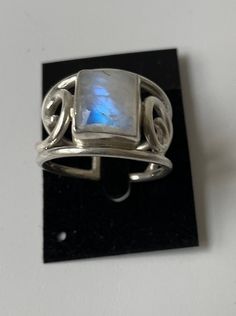 Sterling Silver Wire Ring with bezel-set square shaped Rainbow Moonstone (semi-precious stone), new Genuine 925 Sterling Silver For women or men, new Sizes: 17 - DE (N - UK size) | 18 - DE (Q - UK size)  | 19 - DE (R1/2 - UK size) Open, adjustable Matching bracelets available (see Bracelet section) Every stone has a unique pattern. Each item is carefully handcrafted by a small group of local crafts men in Nepal, to own design, thus minor variations may occur. Adjustable Rectangular Sterling Silver Ring, Adjustable Sterling Silver Ring With Rectangular Stone, Unique Rectangular Adjustable Rings, Adjustable White Gold Moonstone Ring Gift, Adjustable Silver Hallmarked Moonstone Ring, Adjustable Silver Moonstone Ring Hallmarked, Silver Rectangular Moonstone Ring Gift, Unique Silver Jewelry With Rectangular Stone, Adjustable Gemstone Ring With Rectangular Stone