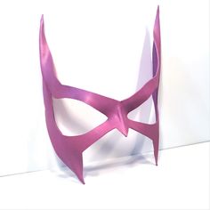 a pink mask is shown against a white background