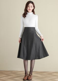 "★★ FEATURES * wool skirt * Polyester lining * No pockets * Back zipper closure * Thicken skirt * High waisted Skirt * Perfect for Winter, autumn * Dry clean ★★ The model is 170 cm (5′ 7″) tall with a 80 cm (31.5\") bust, 66 cm (26\") waist. She is wearing the swing wool skirt in size XS with 70cm length. ★★ Bespoke Order Service If you Request other color Request the length Your height is not between 155 cm- 172 cm Your weight is over 75 kg I can do it for you, It will need some extra fee depen Stretch A-line Skirt For Fall, Winter Workwear Skirt, Fitted Denim Skirt For Winter, Stretch Winter Skirt, Winter Wool A-line Skirt, Fitted A-line Skirt For Winter, Winter Knee-length Lined Pleated Skirt, Stretch Skirt For Winter Workwear, Stretch Winter Skirt For Workwear