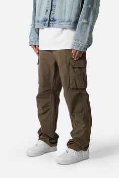 the Ultra Baggy Vintage Cargo Pants are designed with an oversized, relaxed fit throughout with gusseting at the knee, cargo pockets at the side seam, a cinch-able waistband, zipper fly, and finishing off with elastic and cargo drawcords at the leg openings. details baggy fit 100% cotton  zipper fly drawcords at leg op Vintage Cargo Pants, Layered Hoodie, Pants Outfit Men, Moto Pants, Cotton Cargo Pants, Baggy Trousers, Loungewear Shorts, Designer Clothes For Men, Denim Flares