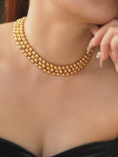 Description: Elevate your style with the timeless elegance of our Tayah Golden Beaded Choker Necklace. This exquisite piece is crafted from high-quality brass with a gold plating finish, creating a luxurious and durable design. Featuring a series of perfectly polished gold beads, the necklace is designed to sit gracefully on the collarbone, adding a touch of sophistication to any outfit. The adjustable extension chain ensures a comfortable and customizable fit, making it ideal for both everyday wear and special occasions. Details: Material: Gold-plated brass Length: 31 cm with an 8 cm extension chain Weight: Approximately 57g Care Instructions: Avoid direct contact with water, perfumes, and chemicals to maintain the necklace's shine and longevity Pearl Jewelry Necklace, Natural Stones Necklace, Gold Statement Earrings, Natural Stone Jewelry, Natural Stone Bracelets, Beaded Choker Necklace, Anklet Bracelet, Anklet Jewelry, Cord Necklace