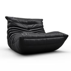 a black leather reclining chair on an isolated white background with no people around it