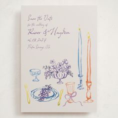 a wedding card with candles and flowers on it