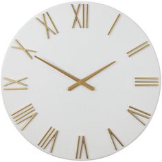 a white clock with gold roman numerals