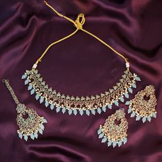 Immerse yourself in the enchanting world of elegance with our Blue Handmade Punjabi Jewelry Set. This exquisite ensemble, inspired by the rich traditions of Indian Bollywood fashion, is a testament to fine craftsmanship and timeless beauty. Perfect for weddings, parties, and engagement celebrations, this high-quality jewelry set is designed to make you stand out on your special day. The necklace, earrings, and tikka in this set are meticulously handmade, showcasing the skillful artistry that goe Punjabi Jewelry, Engagement Celebration, Jewelry Indian, Wedding Jewellery, Girls Jewelry, Engagement Jewelry, Wedding Jewelry Sets, Jewellery Sets, Jewelry Wedding