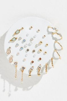 Set of 40 small delicate studs including 13 sets with shimmering stones and 7 sets with fun metal shapes. Easily mix and match to create your unique look. Micro Earrings, Cute Earring Sets, Cute Earring Studs, Earring Pack, Stacked Gold Earrings, Elegant Earring Stack, Cute Earring Stacks, Earrings Set, Rose Gold Earring Stack