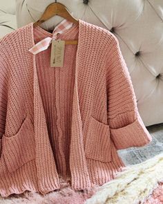 We love this cozy sweater. The absolute softest pink nubby knit pairs with an open front, slouchy cuffed cropped sleeves & cozy front pockets. Slouchy fit. Perfect cozying up by the fire. Color: Pink Poly Hand wash cold Small Medium Large Bust 36 38 40 Waist 36 38 40 Hips 39 40 42 Length 27 27 27 Bust, waist, and hip measurements are a total circumference. Length is measured from the top of the sweater to the hem. Measurements are an estimate. Cozy Textured Knit Cropped Sweater For Loungewear, Cozy Textured Knit Cropped Sweater With Relaxed Fit, Comfy Pink Sweater For Fall, Cozy Cropped Sweater For Spring With Soft Texture, Spring Cozy Cropped Sweater With Soft Texture, Pink Sweater With Soft Texture For Loungewear, Cozy Relaxed Fit Sweater With Pockets, Cozy Pink Sweater With Pockets, Cozy Pink Cropped Sweater For Winter