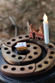 a candle is sitting on top of some sort of object that looks like a puzzle