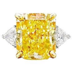 Fantastic GIA Certified 10 Carat Fancy Yellow Radiant Diamond Ring" is a remarkable piece of jewelry. "GIA Certified" indicates that the diamond has been thoroughly examined and authenticated by the Gemological Institute of America, a highly reputable gemological laboratory. This certification assures the diamond's quality and authenticity. The "10 Carat" designation refers to the weight of the diamond, with a 10-carat diamond being exceptionally large and rare. This substantial size adds to the Fancy Yellow Diamond Ring, Radiant Diamond Rings, Graff Diamonds, Orange Diamond, Yellow Diamond Ring, Radiant Cut Engagement Rings, Yellow Diamond Rings, Yellow Engagement Rings, Fancy Yellow Diamond