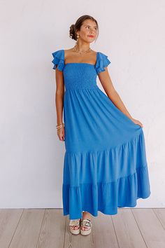 - Say hello to summer maxi vibes with this beautiful dress! - Unlined material - A square cut neckline - Elastic flutter sleeves - A smocked bodice - A flowy yet flattering silhouette that ends in a maxi length hemline Ruched Smocked Maxi Dress For Beach, Ruched Smocked Maxi Dress For The Beach, Beach Smocked Maxi Dress With Elastic Neckline, Beach Maxi Dress With Smocked Back And Square Neck, Maxi Smocked Dress For Beach, Breezy Maxi Dress With Smocked Bodice, Square Neck Maxi Dress With Smocked Back For Brunch, Flowy Summer Smocked Maxi Dress, Square Neck Smocked Dress For Vacation