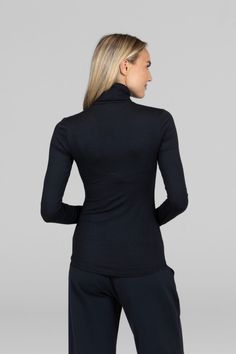 Why we love this: Elevate your winter style with our Black Turtleneck Sweater. Crafted with a cozy blend of comfort and sophistication, this versatile wardrobe staple is perfect for layering or wearing solo, ensuring a timeless and chic look. Features: KiraGrace Luxe: Feels soft and luxurious Close-fitting, ultra soft, and smooth Long sleeve with thumbhole details Transitions from studio to street Turtleneck design Made in U.S.A. of imported fabric FIT: Form-fitting, hip-length hem that stays pu Black Turtleneck Sweater, Travel Pants, Versatile Wardrobe, Black Turtleneck, The Grace, Yoga Tops, Top Sales, Winter Style, Tight Leggings