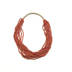 "Bohemian natural red coral multistrand beaded necklace with hemp. About 1.75\" wide and 30\" in length." Bohemian Red Coral And Wooden Beads, Orange Bohemian Red Coral Beads, Bohemian Orange Red Coral Beads, Red Handwoven Necklaces With Round Beads, Artisan Multi-strand Hand-strung Necklaces, Multi-strand Red Coral Beaded Necklace As Gift, Multi-strand Red Coral Beaded Necklace For Gift, Traditional Multi-strand Red Coral Necklaces, Traditional Multi-strand Red Coral Necklace