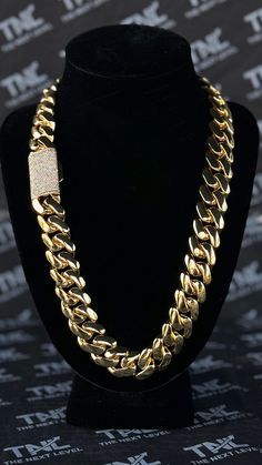 PRODUCT IS BACK IN STOCK AND READY TO SHIP - GRAB YOURS NOW BEFORE THEY'RE GONE AGAIN! 🚀🔥 ⛓ The Chain: Introducing our stunning 20mm Cuban Link Chain with a dazzling diamond clasp! Measuring 24 inches in length, this exquisite piece of jewelry is the perfect addition to any fashion-conscious individual's collection. Crafted with precision and care, this chain boasts a bold 20mm width that exudes strength and confidence. The links are made with a high-quality metal that is both durable and long-lasting, ensuring that this chain will withstand the test of time and remain a treasured possession for years to come. The highlight of this Cuban Link Chain is its striking diamond clasp, which adds a touch of luxury and sophistication to an already impressive piece. This clasp is adorned with shi Gold Cuban Link Necklace For Streetwear, Chunky Chain Cuban Link Necklace For Streetwear, Chunky Cuban Link Necklace For Streetwear, Luxury Chunky Cuban Link Necklace, Gold Cuban Link Necklace With Curb Chain For Streetwear, Gold Chunky Chain Jewelry For Streetwear, Luxury Iced Out Link Chain Necklace, Cuban Link Chain Necklace For Streetwear, Luxury Chunky Cuban Link Chain Jewelry