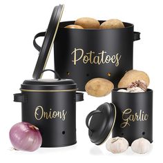 three black containers with potatoes and garlic in them