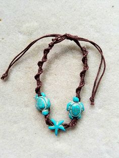 "Pair of turquoise polymer sea turtles and a starfish adorn this boho style of sliding, knotted cord 'friendship bracelet' or anklet. Diameter of opening is 12.5 \", easily slides over womens size 8.5-9 shoe for anklet. (Matching earring sold separately, https://www.etsy.com/listing/607942985/surf-buddy-earrings-turquoise-sea-turtle)" Adjustable Strand Jewelry With Sliding Knot, Turquoise Adjustable Beach Bracelet, Turquoise Adjustable Beach Bracelets, Adjustable Turquoise Friendship Bracelets For Beach, Turquoise Adjustable Friendship Bracelets For Beach, Hippie Turquoise Friendship Bracelets For Beach, Bohemian Starfish-shaped Turquoise Jewelry, Adjustable Ocean-inspired Jewelry For Vacation, Bohemian Turquoise Starfish Jewelry