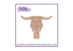 an image of a longhorn skull with intricate designs on it's face and the words southern room mens decor com