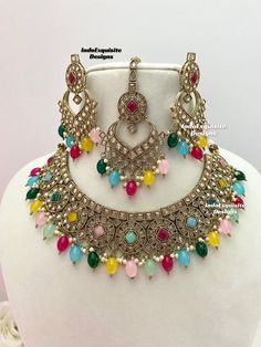 Antique Gold Polki Necklace Set comes with earrings and tikka / Indian Jewelry/ High Quality Kundan and Polki Jewelry/ Bollywood Jewelry/Wedding Jewelry/multi color All items are shipped from Brampton, Ontario, Canada. If you need your item by a certain day, please reach out to us for express delivery option before placing the order so that we can update the shipping for you. Standard shipping/delivery timeline Below are the delivery timeline estimates once the order ia shipped ---> USA delivery timeline * 3-5 business days to major urban centers in USA. It may take 1-2 days extra to remote locations ---> Canada delivery timeline  * 2-3 business days - GTA  & Montreal  * 2-4  business days - Rest of Ontario/Quebec * 3-6 business days-  Rest of Canada    ---> Europe/Middle East timeline * 5 Luxury Bollywood Style Multicolor Necklace, Luxury Multicolor Bollywood Style Necklaces, Luxury Bollywood Multicolor Jewelry Sets, Luxury Multicolor Meenakari Jewelry Sets, Luxury Multicolor Bollywood Jewelry Sets, Luxury Multicolor Meenakari Bridal Necklace, Luxury Multicolor Bollywood Necklace, Luxury Bollywood Multicolor Necklace, Luxury Multicolor Meenakari Sets