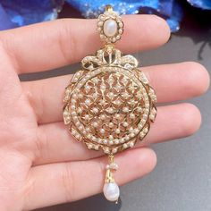 Featuring a beautiful pearl pendant set in 22ct gold. It has been embellished with precious pearls. This timeless piece of jewelry will never go out of style, allowing you to cherish its beauty for years to come. It weighs 15.39 GMs including 0.82 GMs of hanging pearls Price Breakup Summary Component Rupees % of Total 22k Gold 74,910 77.5% Stones & Beads 5,471 5.7% Making Charges 13,484 13.9% Taxes (GST) 2,816 2.9% Total 96,681 100.0% View Detailed Price Breakup Here 22k Yellow Gold Jewelry With Pearl Pendant, Gold-plated Pearl Pendant Earrings For Wedding, Gold Plated Pearl Pendant Earrings For Wedding, Wedding Pearl Pendant Earrings In Yellow Gold, Yellow Gold Pearl Pendant Earrings For Wedding, Yellow Gold Pearl Earrings With Pendant For Wedding, Wedding Pearl Earrings With Yellow Gold Pendant, Wedding Yellow Gold Pearl Pendant Earrings, Elegant 22k Gold Pearl Pendant