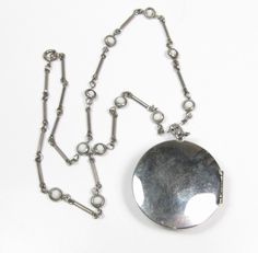 "Beautiful Vintage Silver Tone Locket Necklace. The locket opens and closes as it should. You can fit a quarter in it. Decorative chain measures 16\". The locket measures 1-1/2\" tall x 1-1/2\". Very good condition. Please see all photos. Feel free to ask questions. Check our other listings as well. Thank you!" Vintage Locket Necklace With Lobster Clasp, Vintage Locket Necklace With Round Pendant, Vintage Medallion Locket Necklace With Lobster Clasp, Locket Chain, Photo Locket, Glass Photo, Locket Necklace, 1960s Vintage, White Glass