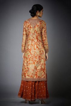 Rust and beige straight long kurta with aari hand embroidery and floral motif print. Comes with gharara and dupatta.
Component: 3
Embroidered, Printed
Neckline: Round
Sleeve Length: Long
Fabric: Silk; Lining: 100% Viscose
Color: Beige,Orange
Split neck
Side slits - Aza Fashions Orange Semi-stitched Sharara With Straight Kurta, Orange Straight Kurta Sharara For Navratri, Bollywood Style Orange Sharara With Straight Kurta, Festive Orange Sharara With Straight Kurta, Transitional Floor-length Sharara With Resham Embroidery, Orange Bollywood Style Sharara, Navratri Raw Silk Sharara With Chikankari Embroidery, Orange Straight Kurta Sharara For Festive Occasions, Raw Silk Sharara With Chikankari Embroidery For Navratri