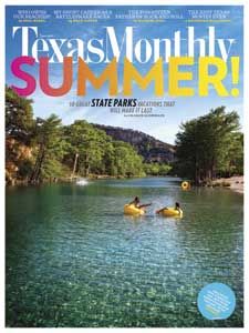 a magazine cover with two people in kayaks floating on the water and trees around