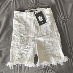 Size 1 White Fashion Nova Distressed Shorts. They Run True To Size And Are Super Stretchy! They Are High Waisted And Come Down About Mid Thigh Length. Only Tried One, Never Worn Out. Tags Still On Them. They Have Rips On Both The Front And Back Of The Shorts, With That Being Said The Back Tears Shows Some Skin. High Waist Ripped White Bottoms, White High Waist Ripped Bottoms, High-waisted White Ripped Bottoms, White High-waisted Ripped Bottoms, Fitted Distressed White Bottoms, White Knee-length Jean Shorts For Summer, Stretch Distressed White Bottoms, White Distressed High Waist Bottoms, White Ripped Bottoms For Spring