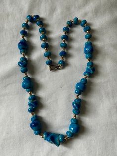 "Unique Egyptian Handmade Blue Ceramic c Necklace    With Gold plated beads   Size: Approximately 23\" Total (End to End).   For more items: Visit our store at https://www.ebay.com/str/scarabbazaaregyptiangifts" Vintage Blue Necklaces With Oval Beads, Vintage Blue Oval Bead Necklace, Vintage Blue Necklace With Oval Beads, Vintage Blue Beaded Necklaces With Spacer Beads, Blue Polished Beads Costume Jewelry, Blue Turquoise Necklace With Spacer Beads As Gift, Blue Faceted Oval Beads, Blue Polished Beads Costume Jewelry Necklace, Vintage Blue Single Strand Beaded Necklaces