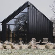 a black building with the word chewwell written on it's front lawn area