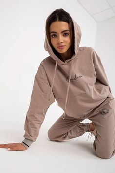 A sweatshirt set consisting of a sweatshirt and pants. Sweatshirt with long sleeves, hood and kangaroo pocket. Long pants with a tie at the waist, slip pockets on the sides. Cotton 90 % Spandex 10 % Size Lenght Chest Waist S/M 57/99 cm 120 cm 78 cm Athleisure Tracksuit With Drawstring And Relaxed Fit, Relaxed Fit Athleisure Tracksuit With Drawstring, Athleisure Hooded Sweats For Loungewear, Leisure Drawstring Hoodie Sweatshirt, Athleisure Loungewear Sweats With Drawstring Hood, Sporty Tracksuit With Hoodie For Leisure, Hoodie Sweats With Drawstring Hood For Loungewear, Casual Sweatpants With Kangaroo Pocket For Loungewear, Sporty Drawstring Hoodie For Leisure