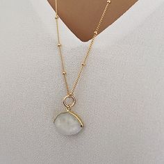 Long Moonstone Gold Necklace for layering 14k Gold Filled Satellite chain - Jewelry gift ideas for wife, mom, bride, bridesmaids, girlfriend Gemstone: Genuine Moonstone Pendant Size: 20x15mm Bezel: Vermeil Gold Chain: Satellite Chain: 14K Gold Filled with spring ring clasp Chain: 1mm Length: 24 inches About "Gold Filled Jewelry": Also called rolled-gold. These jewelry items are not actually filled with gold. They are made of a base metal covered by sheets of gold in a mechanical bonding process. Gold Moonstone Pendant Necklace, White Moonstone Necklace With Delicate Chain, Dainty Moon Phase Necklaces For Wedding, Dainty Moon Phase Necklace For Wedding, Dainty Moon-shaped Wedding Necklace, Gold Moonstone Round Necklaces, Gold Moonstone Gemstone Necklace, Gold Plated Moon Charm Necklace For Anniversary, Gold Gemstone Necklace With Moonstone