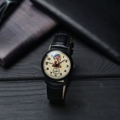 "Vintage Pobeda watch \"Belka & Strelka\" - Belka and Strelka are Soviet astronaut dogs that flew in the Sputnik 5 spacecraft on August 19, 1960. NEW OLD STOCK Year: 1970-1990s Case size: 34mm Strap widht: 18mm Made in USSR Pobeda watches were always in great demand, but few could afford them at that time. They were produced after World War II, at the first official watch factory in Moscow, Kirov, in 1946. This watch made a real sensation among connoisseurs of the classic sustained style. Th Retro Automatic Collectible Watches, Retro Round Watch As Gift, Nostalgic Automatic Watch With Round Dial, Retro Round Watch For Gift, Nostalgic Automatic Watches With Round Dial, Nostalgic Analog Watch As Gift, Vintage Black Collectible Watch, Soviet Astronaut, Belka And Strelka