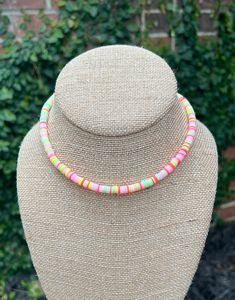 Fun and funky, this disc bead necklace is the perfect gift for any kid! Choose from neon pastel or primary colors. Cute Multicolor Beaded Necklaces For Summer, Playful Multicolor Beaded Necklaces For Summer, Playful Beaded Necklaces For The Beach, Cute Multicolor Round Bead Necklaces, Casual Pink Necklace For Festivals, Fun Pink Beaded Necklaces With Round Beads, Casual Pink Necklace With Round Beads, Fun Multicolor Adjustable Beaded Necklaces, Fun Pink Beaded Necklaces With Letter Beads