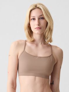 Supersoft, seamless, stretch nylon-blend bralette.  Scoop neck, racerback.  Elasticized trim at scoopneck, spaghetti straps.  This product was made in a factory that invests in gender equality and women’s empowerment.  Through RISE Reimagining Industry to Support Equality) and Gap Inc. ’s program P. A. C. E.  Personal Advancement & Career Enhancement), we support people who make our clothes to build the skills, knowledge, confidence, and resilience needed to advance in work and life.  Learn more Scoop Neck Bra With Built-in Support, Seamless Sports Bra With Medium Support And Tank Straps, Seamless Sports Bra With Scoop Neck And Minimal Stretch, Seamless Scoop Neck Sports Bra With Minimal Stretch, Seamless Stretch T-back Sports Bra, Medium Support Cami Sports Bra With Built-in Bra, Strappy Back Stretch Camisole With Built-in Bra, Scoop Neck Seamless Bra, Fitted Seamless Sports Bra With Scoop Neck