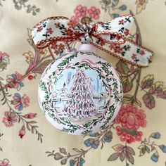 an ornament with a christmas tree on it