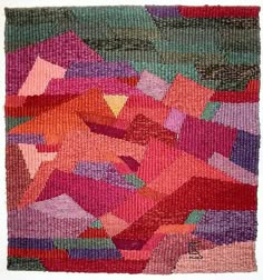 a colorful rug with many different colors and shapes